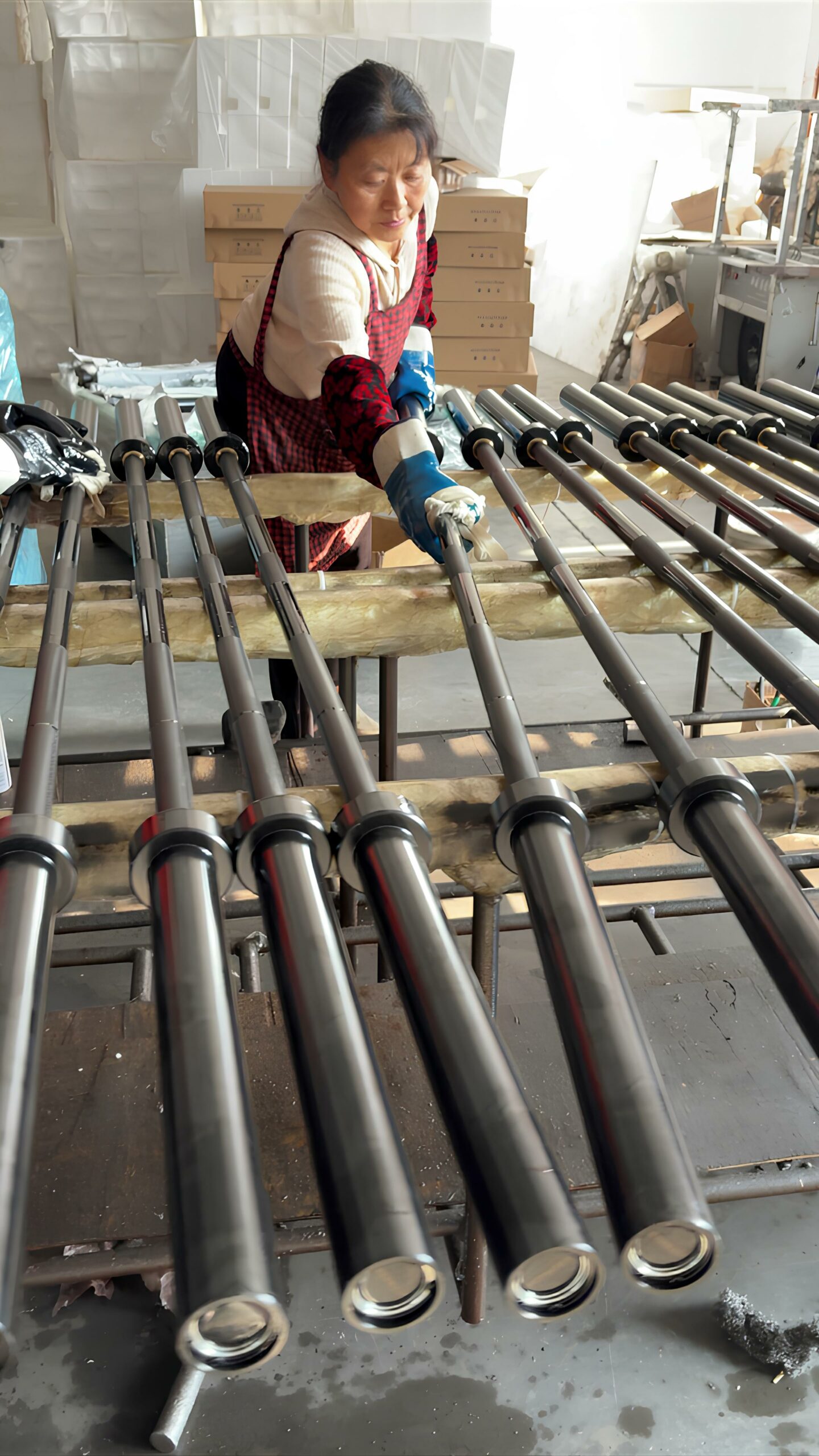 Quality control inspection at our Olympic Barbell Factory